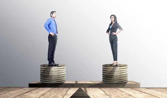 Asian businessman and businesswoman standing on coins stack with same height on balancer

Asian businessman and businesswoman standing on coins stack with same height on balancer. Equality gender concept