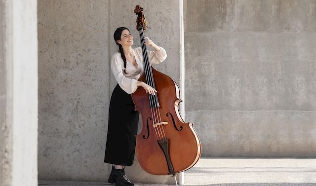 Full-shot-woman-with-double-bass

